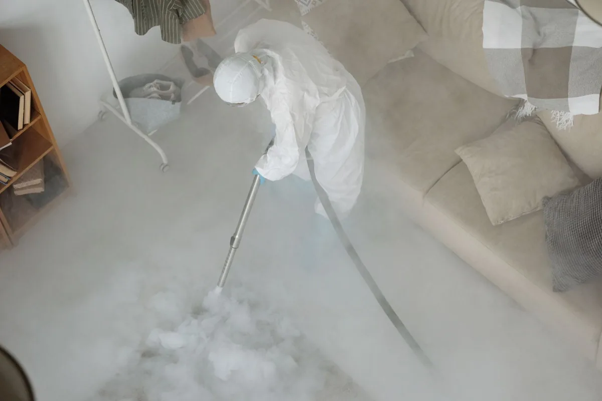 Biohazard cleanup technician in protective equipment, Monticello, WI